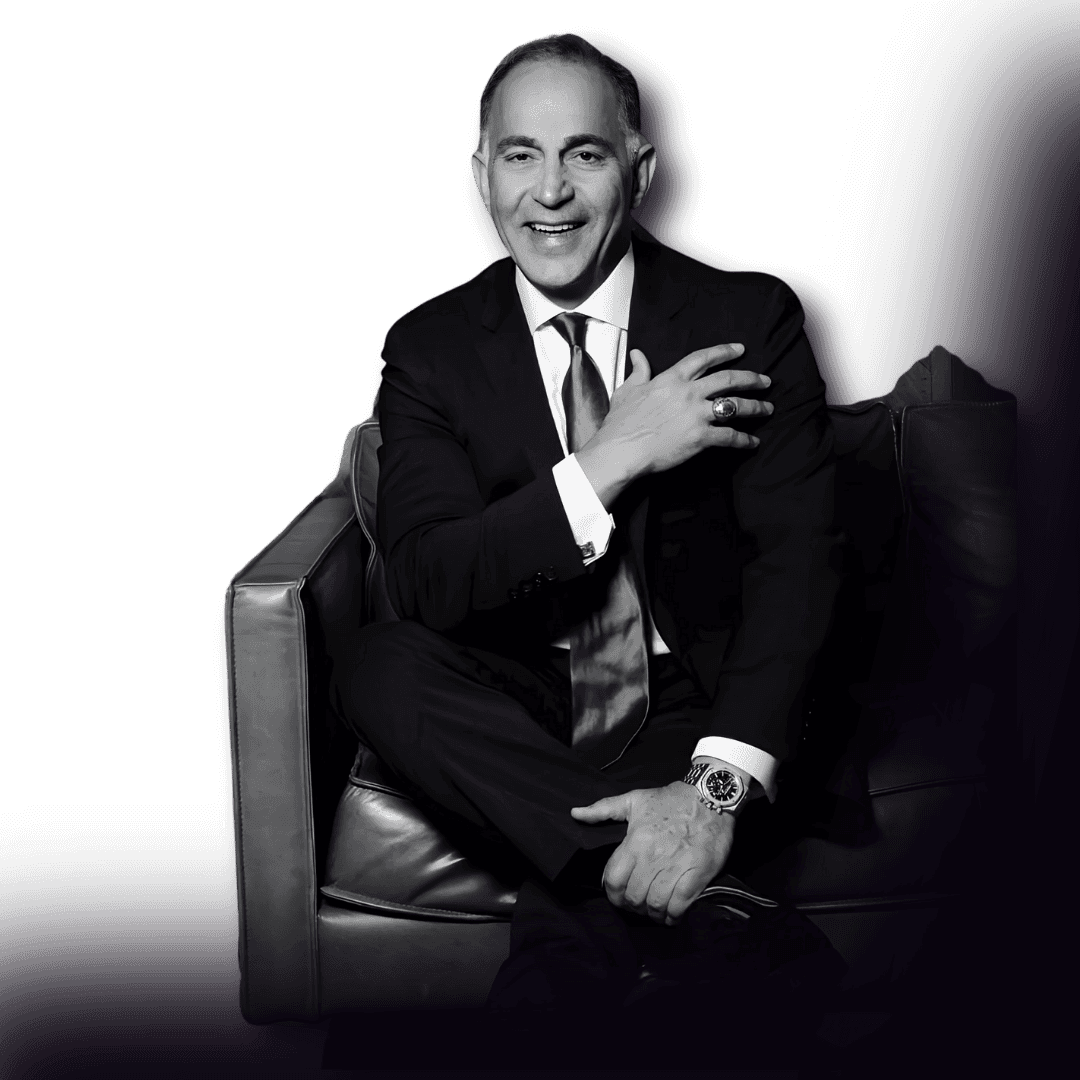Mohammad "Mo" Honarkar seated and smiling in a formal portrait.